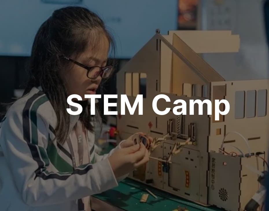 STEM summer camp students building robotics projects at MGA