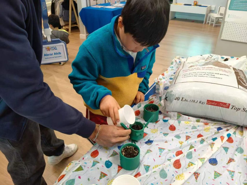 Students learning plant science and coding in MGA Boston STEM program